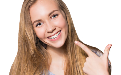 A young girl smiling with her braces