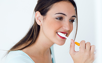 A female brushing her teeth