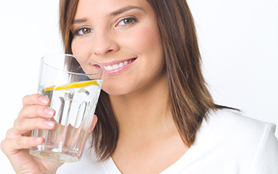 A girl drinking a glass of water